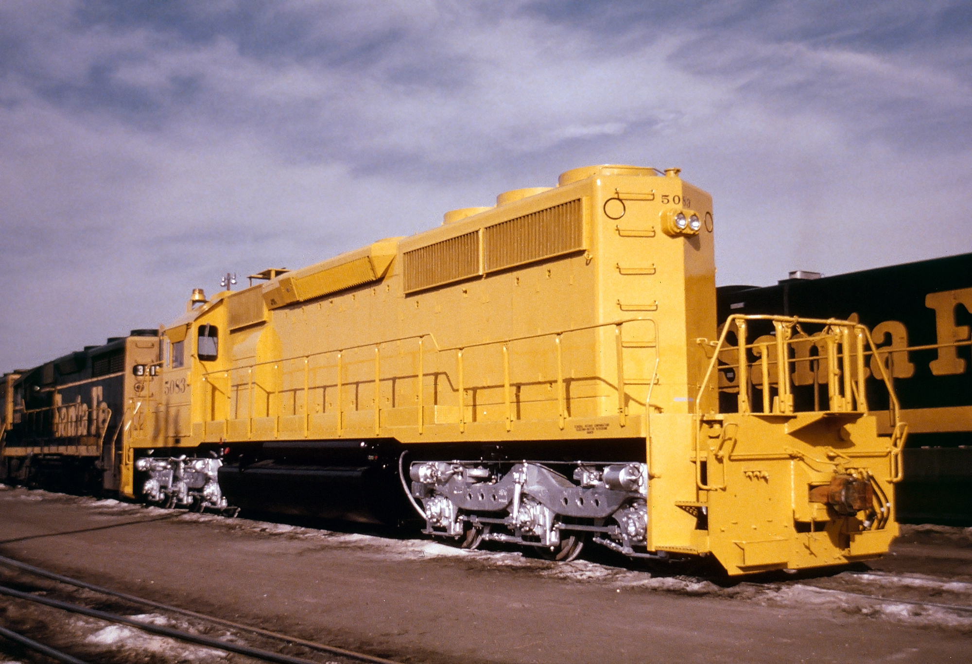 Atchison, Topeka & Santa Fe's only three Fairbanks-Morse Erie-Builts lead  lead train 101, the Centennial State, out of Denver with 7 cars at 30 MPH  in 1951. The poor reliability of the